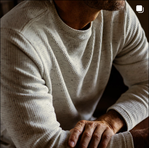 Closeup of man wearing GenTeal Cream McKay Crewneck with waffle-knit texture